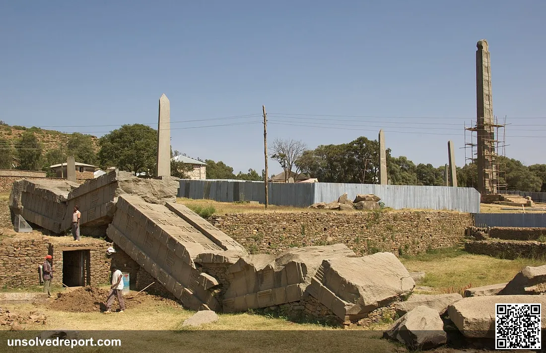 This photo shows part of the North Stelae Park in Axum, Ethiopia. To the left are the shattered remains of the Great Ob…