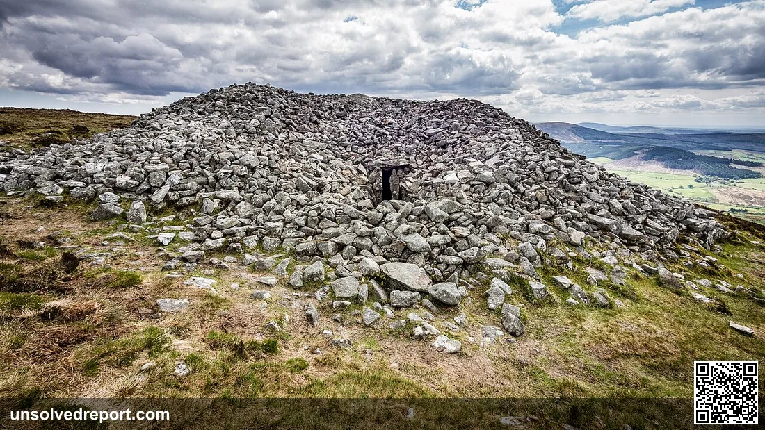 Neolithic passage tomb on the summit of Seefin Mountain, County Wicklow, Ireland. The tomb is covered by a huge circula…